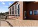 Outdoor wooden deck showcasing stunning natural views and architectural details of the wood home at 18645 Rocky Top Trl, Littleton, CO 80127