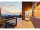 Relaxing deck with a scenic view, natural lighting, and beautiful wooden panels at 18645 Rocky Top Trl, Littleton, CO 80127