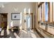 Bright foyer with tiled flooring, wooden accents, and a charming wooden bench at 18645 Rocky Top Trl, Littleton, CO 80127