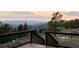 Stunning mountain view from the wooden deck with secure railings at 18645 Rocky Top Trl, Littleton, CO 80127