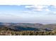 Long distance view with mountains and distant city at 18645 Rocky Top Trl, Littleton, CO 80127