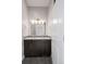 Modern bathroom with dual sinks, dark wood cabinets, vanity mirror and overhead lighting at 2741 W 28Th Ave # 2, Denver, CO 80211