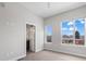 Bright bedroom with two windows, neutral paint and trim, light carpeting and bathroom access at 2741 W 28Th Ave # 2, Denver, CO 80211