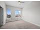Bright bedroom with two windows, neutral paint and trim, light carpeting and a ceiling fan with lighting at 2741 W 28Th Ave # 2, Denver, CO 80211