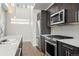 Sleek kitchen with stainless appliances, stylish backsplash, and ample counter space at 2741 W 28Th Ave # 2, Denver, CO 80211