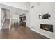 Open concept living area with hardwood floors flows into kitchen with stainless appliances at 2741 W 28Th Ave # 2, Denver, CO 80211