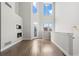 Bright living room featuring soaring ceilings, fireplace, large windows, and modern finishes at 2741 W 28Th Ave # 2, Denver, CO 80211
