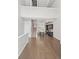 Open concept living area with hardwood floors flows into kitchen with stainless appliances at 2741 W 28Th Ave # 2, Denver, CO 80211
