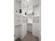 Spacious walk-in closet with built-in shelving, drawers, hanging rods, carpeting and white trim at 2741 W 28Th Ave # 2, Denver, CO 80211