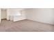 Large bedroom with neutral carpet, white walls, and natural light at 262 Chardon Ave, Brighton, CO 80601