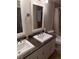 Bathroom featuring double sinks, granite countertop, and shower with a bathtub at 3839 E 135Th Way, Thornton, CO 80241