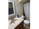 Practical bathroom featuring a single vanity, mirror and a shower with a curtain at 3839 E 135Th Way, Thornton, CO 80241