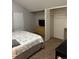 Cozy bedroom with soft carpet, neutral walls, and built-in closet at 3839 E 135Th Way, Thornton, CO 80241
