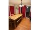 Bright dining room with hardwood floors and stylish curtains at 3839 E 135Th Way, Thornton, CO 80241