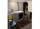 Laundry room with a washer, dryer, furnace, and storage space at 3839 E 135Th Way, Thornton, CO 80241