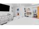 Cozy bedroom showcasing a modern fireplace, mounted TV, and access to ensuite bathroom at 10896 Timothys Dr, Conifer, CO 80433