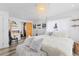 Bright bedroom with unique chandelier, walk-in closet, and modern fireplace at 10896 Timothys Dr, Conifer, CO 80433