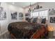 Comfortable bedroom with rustic decor, including a faux fur blanket and log-style furniture at 10896 Timothys Dr, Conifer, CO 80433