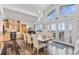 Dining room features views, access to deck, and flows into the kitchen at 10896 Timothys Dr, Conifer, CO 80433