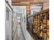 Inviting hallway with wood accents, sliding barn door, and natural light offers a charming space at 10896 Timothys Dr, Conifer, CO 80433