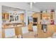 Open kitchen with wood cabinets, stainless steel appliances, and bar seating at 10896 Timothys Dr, Conifer, CO 80433
