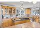 Charming kitchen with wood cabinets, stainless steel appliances, and bright lighting at 10896 Timothys Dr, Conifer, CO 80433