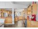 Galley kitchen features stainless steel appliances and wooden cabinetry throughout at 10896 Timothys Dr, Conifer, CO 80433