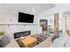 Comfortable living room with a stone accent wall, modern fireplace, and stylish furnishings at 10896 Timothys Dr, Conifer, CO 80433