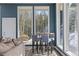 Living room with a bar seating area and mountain views at 10896 Timothys Dr, Conifer, CO 80433