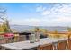 Deck with outdoor dining set overlooking mountain views at 10896 Timothys Dr, Conifer, CO 80433