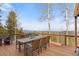 Mountain view from the home's deck with outdoor dining set at 10896 Timothys Dr, Conifer, CO 80433