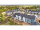 A cluster of tastefully designed townhouses, featuring a blend of gray, and blue exterior paints at 749 Bishop Pine Way, Castle Rock, CO 80104