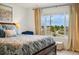 Cozy bedroom with a large window offering neighborhood views at 749 Bishop Pine Way, Castle Rock, CO 80104