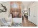Welcoming foyer showcasing hardwood floors and a view of the kitchen at 749 Bishop Pine Way, Castle Rock, CO 80104