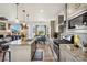 Stylish kitchen features granite countertops, stainless steel appliances, a large island, and an adjacent dining area at 749 Bishop Pine Way, Castle Rock, CO 80104