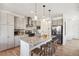 Contemporary kitchen features granite countertops, stainless steel appliances, and a kitchen island with barstool seating at 749 Bishop Pine Way, Castle Rock, CO 80104