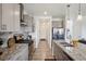 Sleek kitchen with granite countertops, stainless steel appliances, and a large kitchen island at 749 Bishop Pine Way, Castle Rock, CO 80104