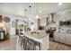 Well-equipped kitchen featuring stainless steel appliances and an island with barstool seating at 749 Bishop Pine Way, Castle Rock, CO 80104