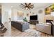 Bright living room featuring hardwood floors, modern decor, and an open layout at 749 Bishop Pine Way, Castle Rock, CO 80104