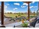Comfortable patio seating area with a view of the beautifully landscaped backyard at 749 Bishop Pine Way, Castle Rock, CO 80104