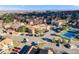 Aerial view of community featuring well-maintained lawns, parking, and greenery at 430 Zang St # 4-301, Lakewood, CO 80228