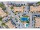 Aerial view showcasing the community's layout with parking, tennis court, and mature trees at 430 Zang St # 4-301, Lakewood, CO 80228