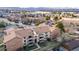 Aerial view of community featuring multiple buildings and manicured lawns at 430 Zang St # 4-301, Lakewood, CO 80228