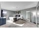 Spacious bedroom with a large mirror, plush carpet, and lots of natural light at 430 Zang St # 4-301, Lakewood, CO 80228