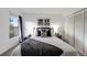 Charming bedroom with a comfortable bed, closet, and a soothing color palette at 430 Zang St # 4-301, Lakewood, CO 80228