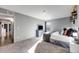 Bright bedroom with carpet, a window and a view, and a comfortable bed setup at 430 Zang St # 4-301, Lakewood, CO 80228