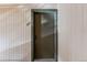 A close up view of the front door, apartment 301, shows a muted green door with sidelight at 430 Zang St # 4-301, Lakewood, CO 80228