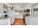 Well-lit kitchen boasting updated appliances, ample counter space, and charming cabinetry at 430 Zang St # 4-301, Lakewood, CO 80228