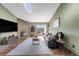 Bright living room with stone fireplace, hardwood floors, and sliding glass door to balcony at 430 Zang St # 4-301, Lakewood, CO 80228