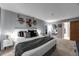 Inviting main bedroom with a large bed, soft lighting, and serene decor at 430 Zang St # 4-301, Lakewood, CO 80228